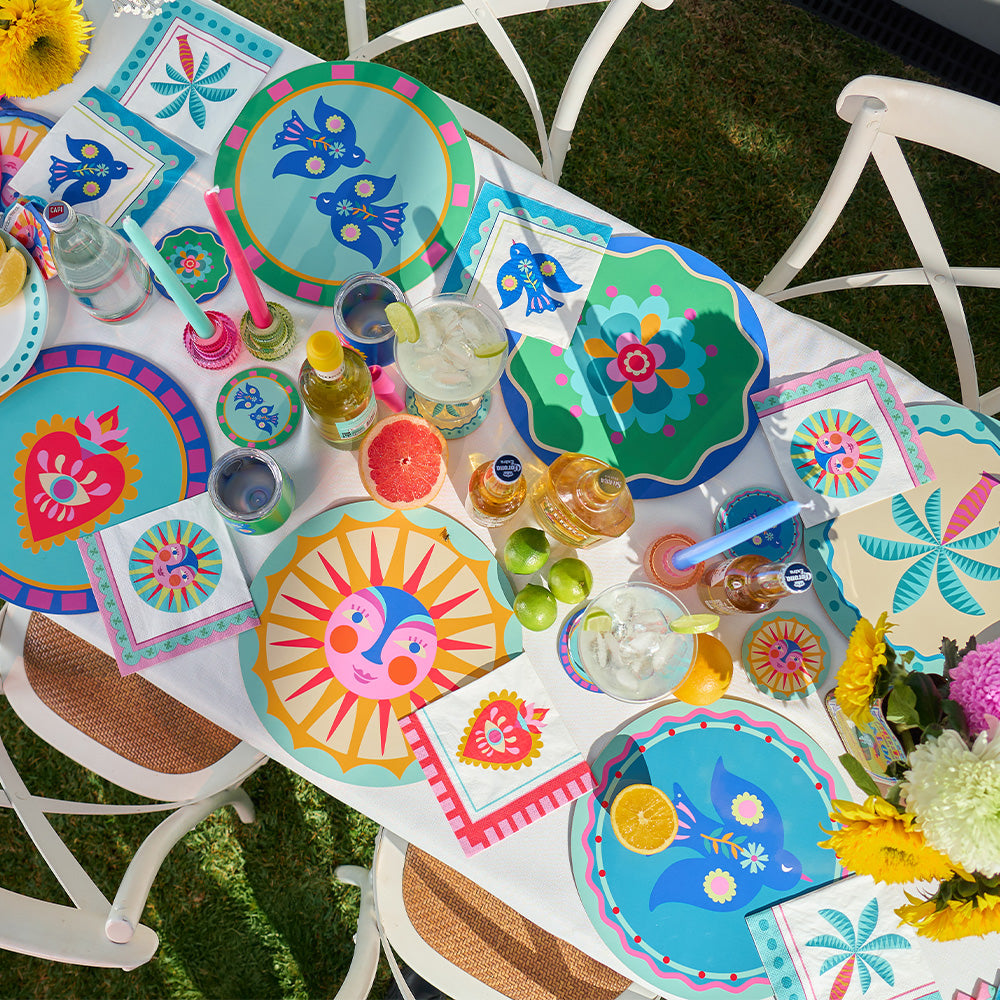 Annabel Trends fiesta table setting with placemats, coasters, paper napkins and platters