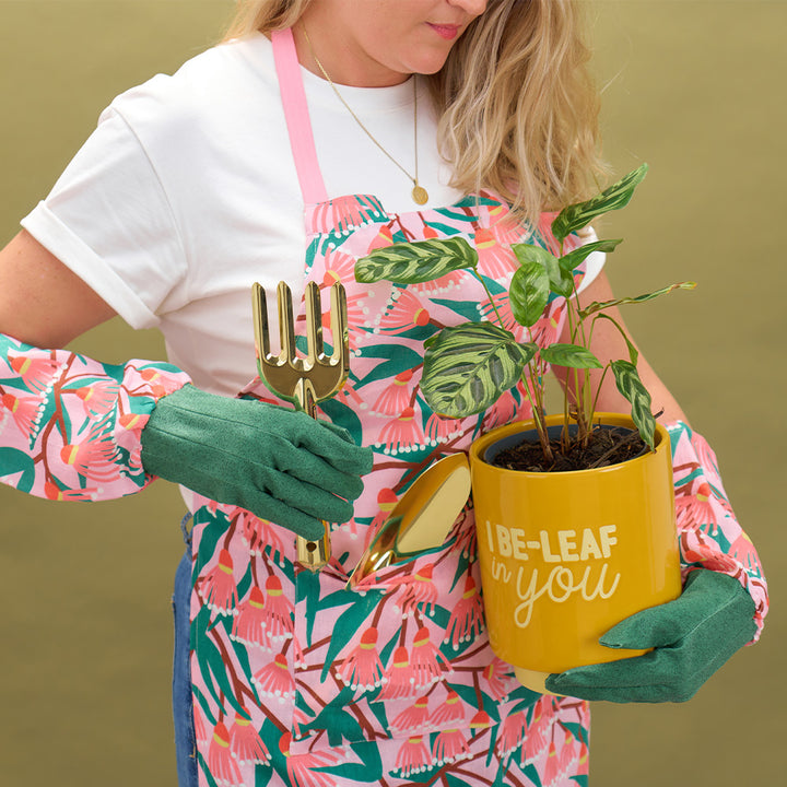 annabel trends blossom branches linen long sleeve garden gloves and apron, gold garden toolsand i be-leaf in you ceramic pot plant