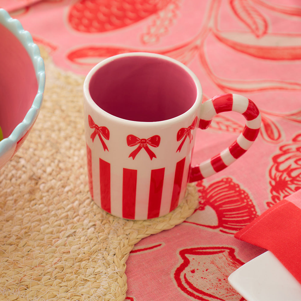 Annabel Trends trailing natives linen tablecloth and red stripe and bow ceramic mug