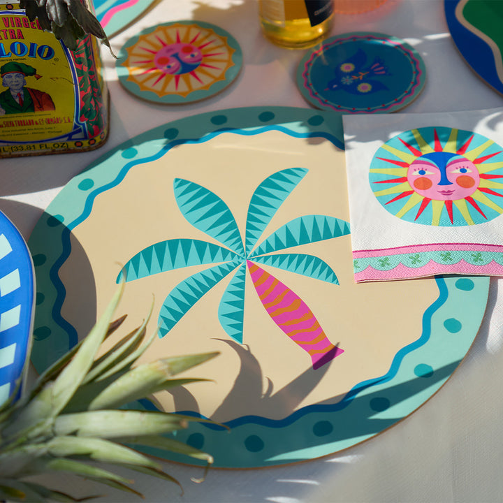 Annabel Trends fiesta table setting with placemats, coasters, paper napkins and platters