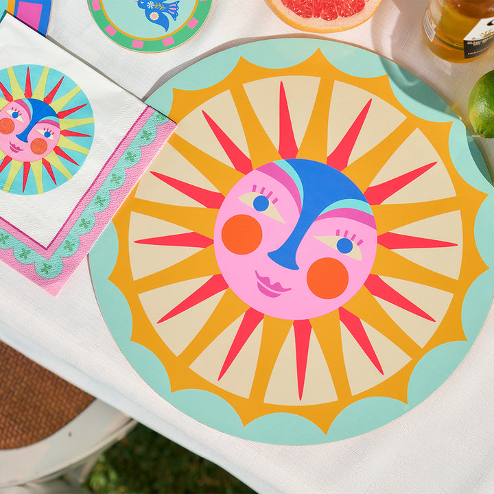 Annabel Trends fiesta table setting with placemats, coasters, paper napkins