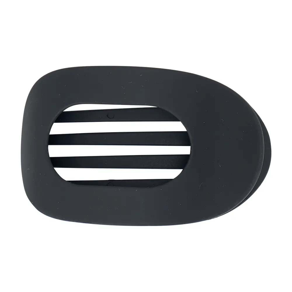 Black plastic hair clip on a white background