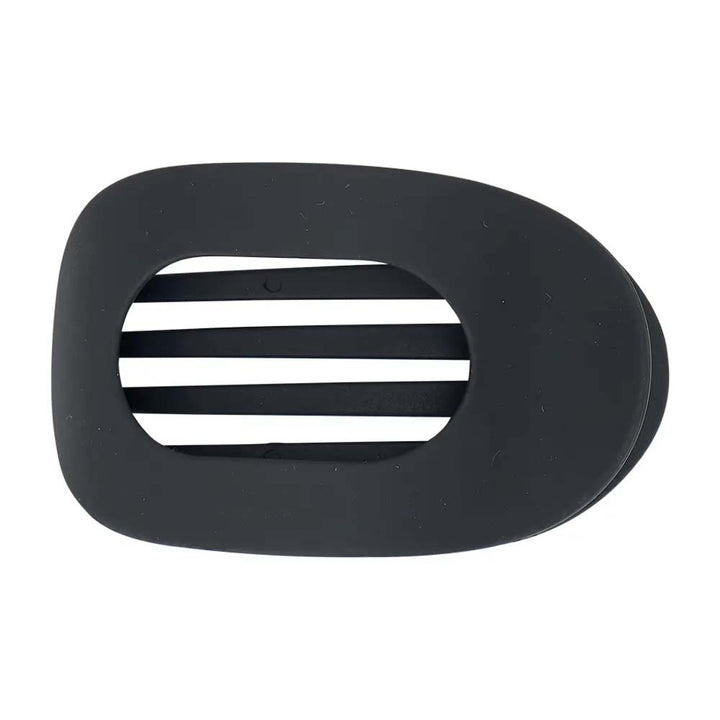 Black plastic hair clip on a white background