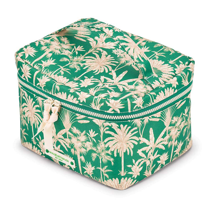 Green travel case with tropical pattern on a white background