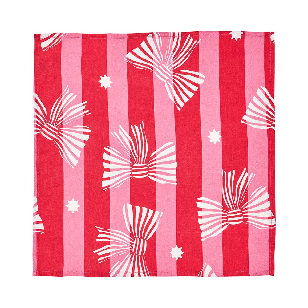 Linen napkin with red and pink striped pattern and white bows on a white background