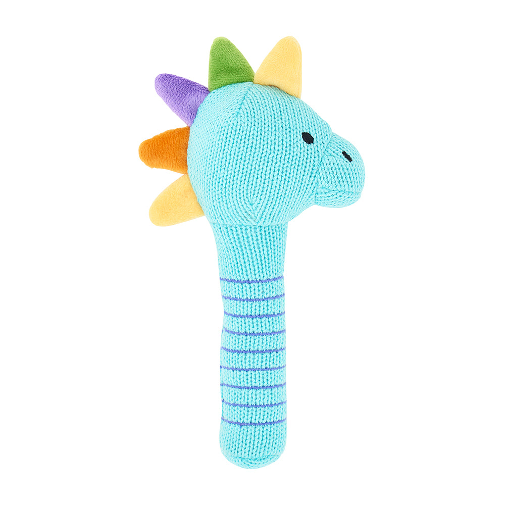 dinosaur knit rattle on white background