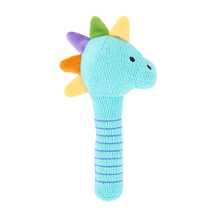 dinosaur knit rattle on white background