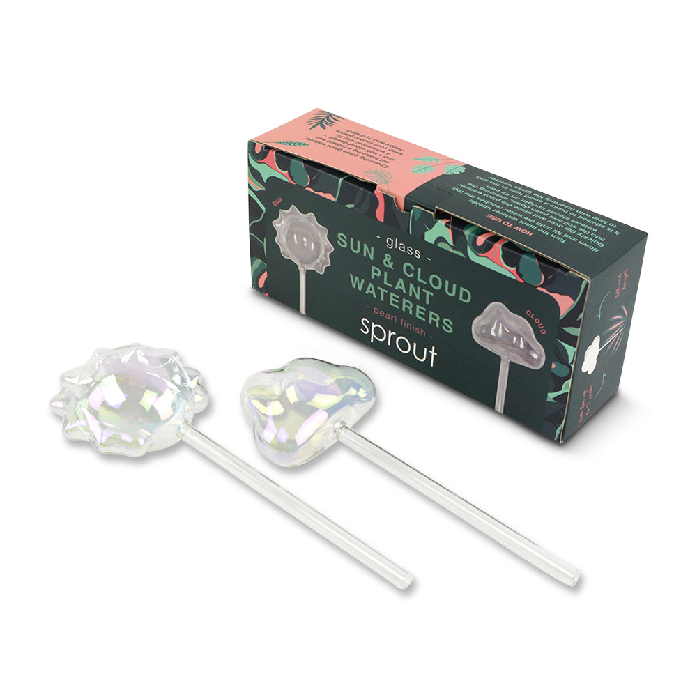 Iridescent crystal plant waterers with packaging on a white background