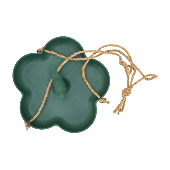 Green flower-shaped bird feeder with a string on a white background