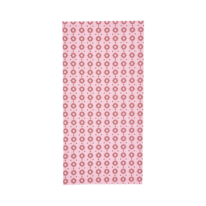 Pink happywrap with a red floral pattern on a white background