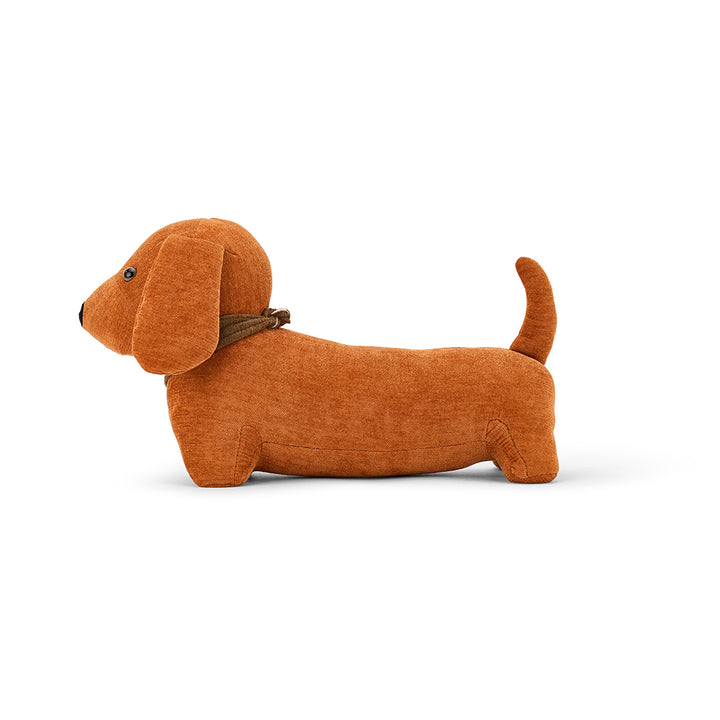 Brown dog-shaped doorstop on a white background