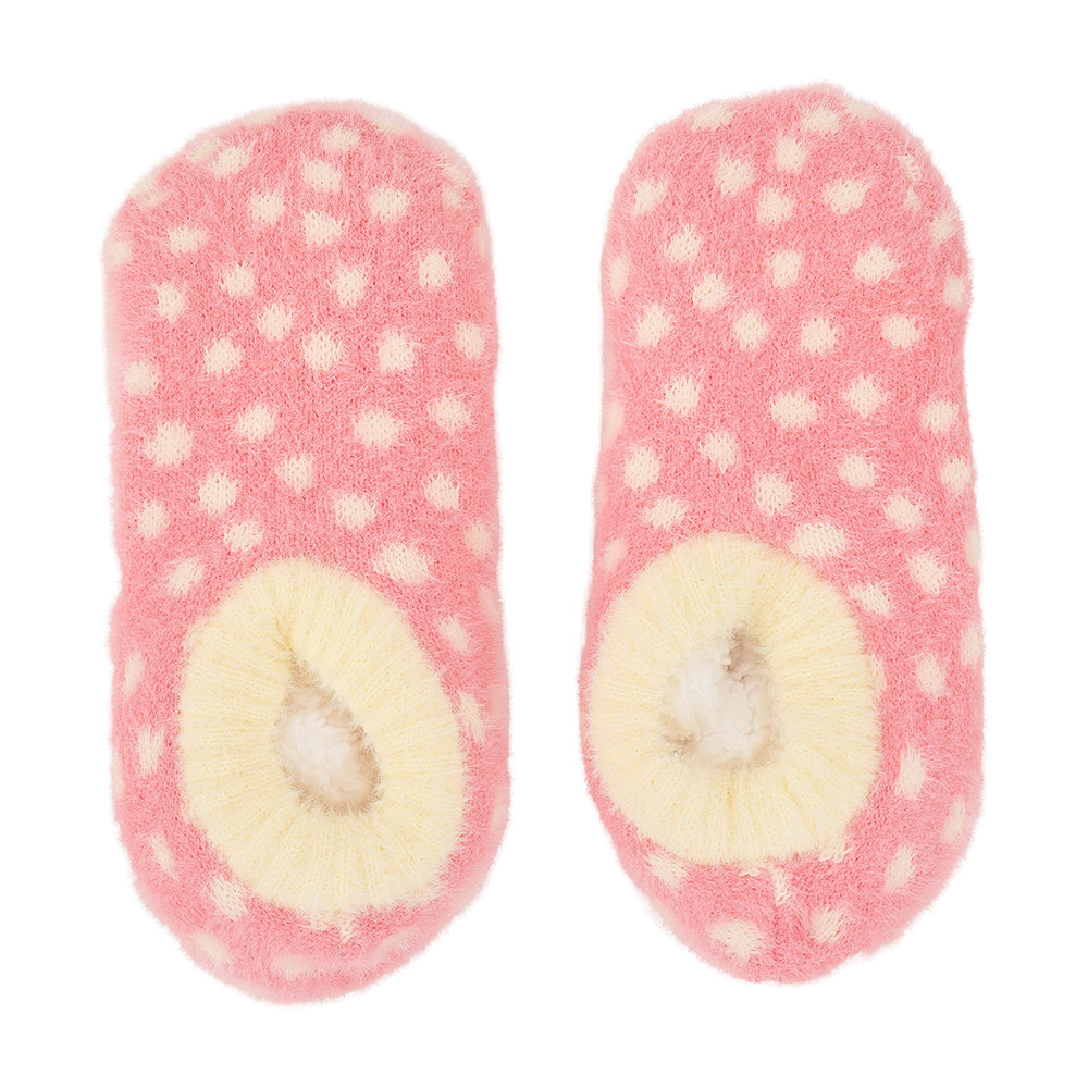 Pair of pink polka dot fuzzy bootie socks on a white background