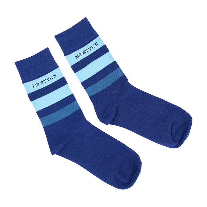 Pair of blue socks with striped pattern on a white background