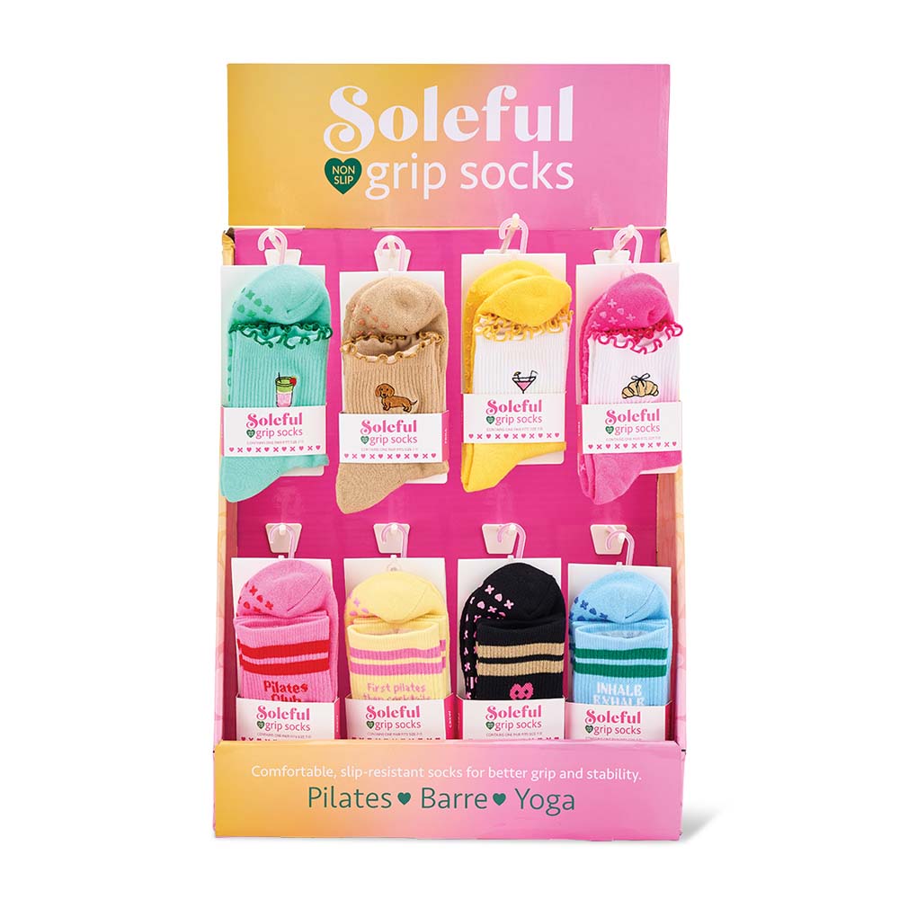 Box of Soleful grip socks with colorful designs on a white background