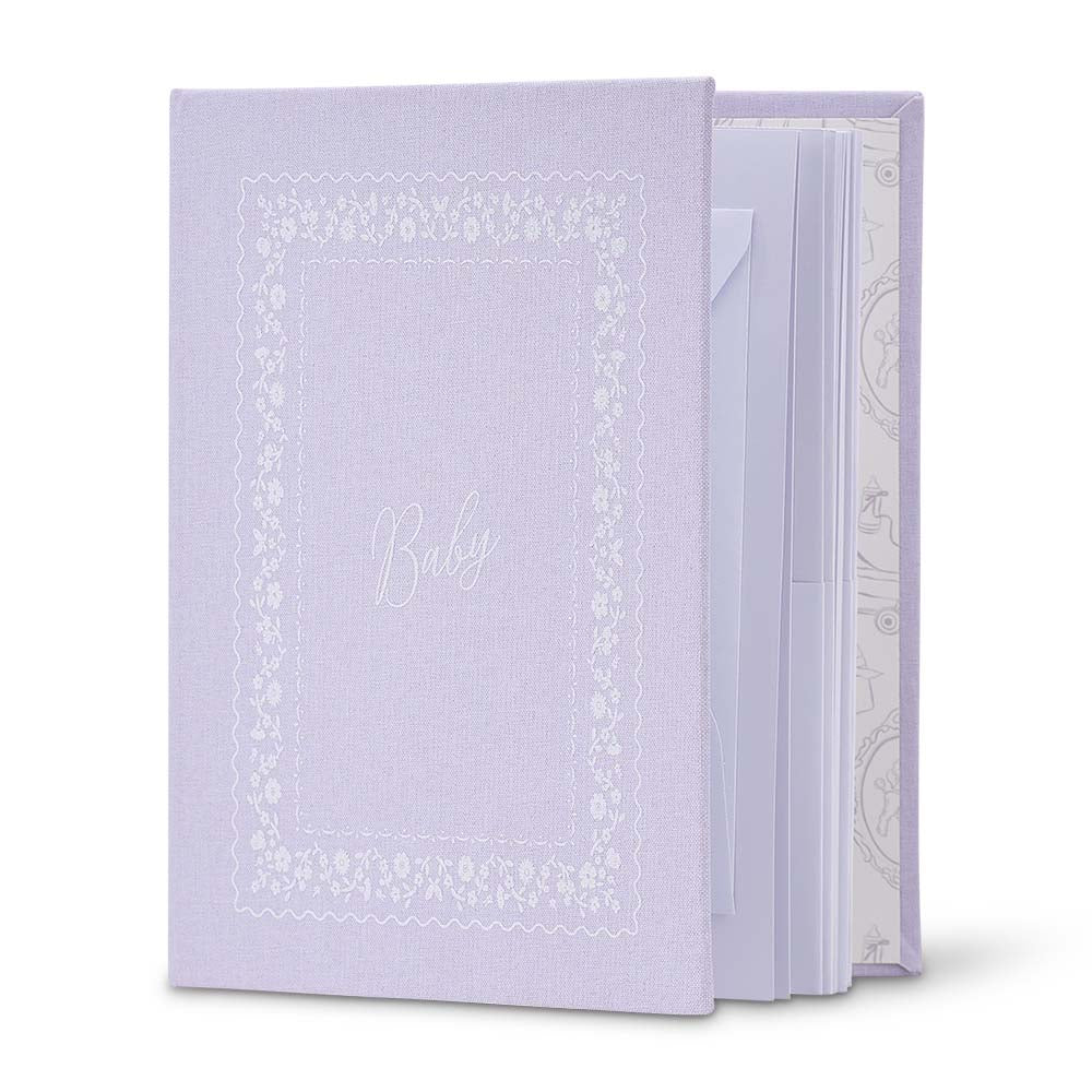 Lavender notebook with decorative cover on a white background