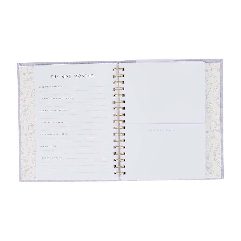 Open spiral-bound notebook with decorative cover on a white background