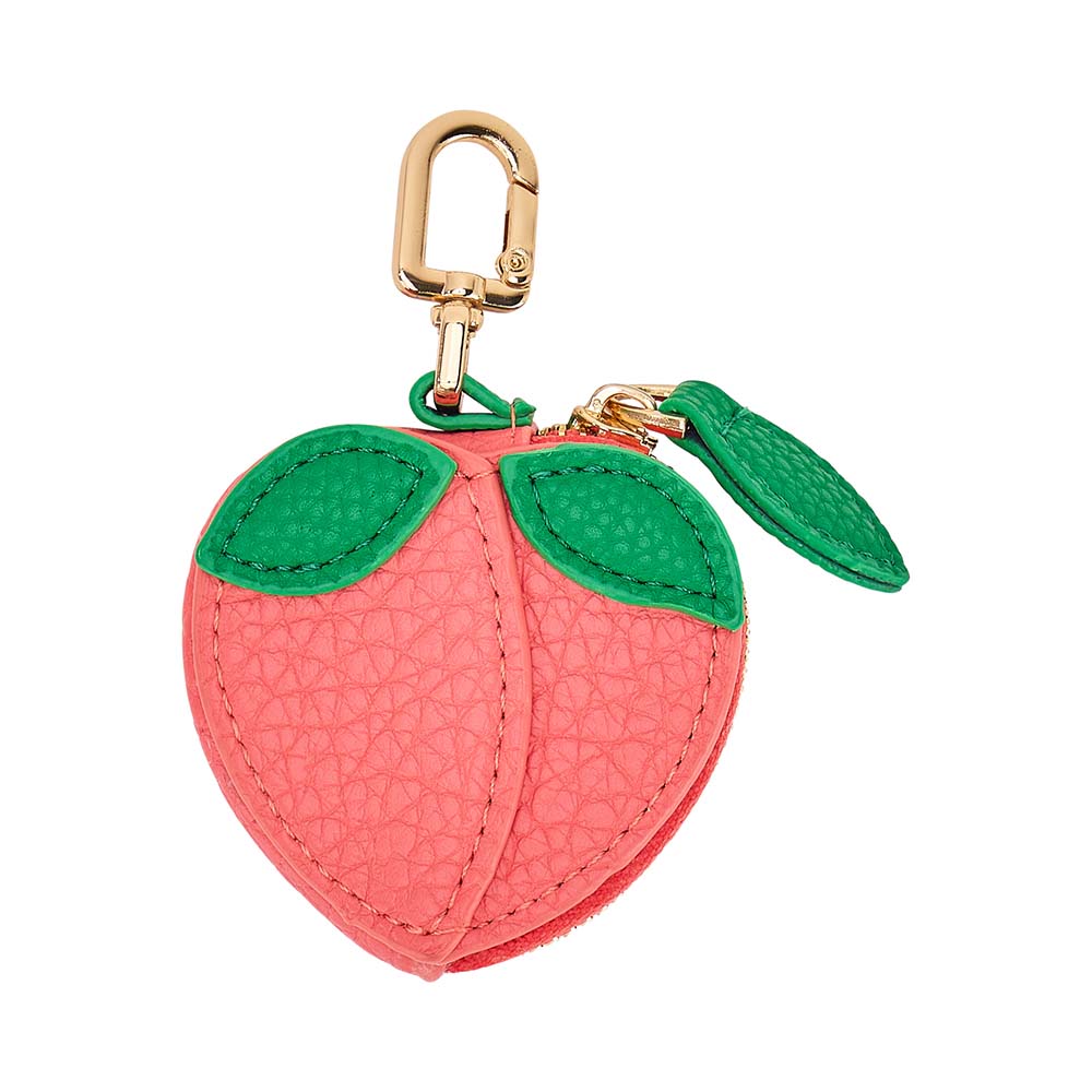 Pink apple-shaped keychain with green leaves on a white background