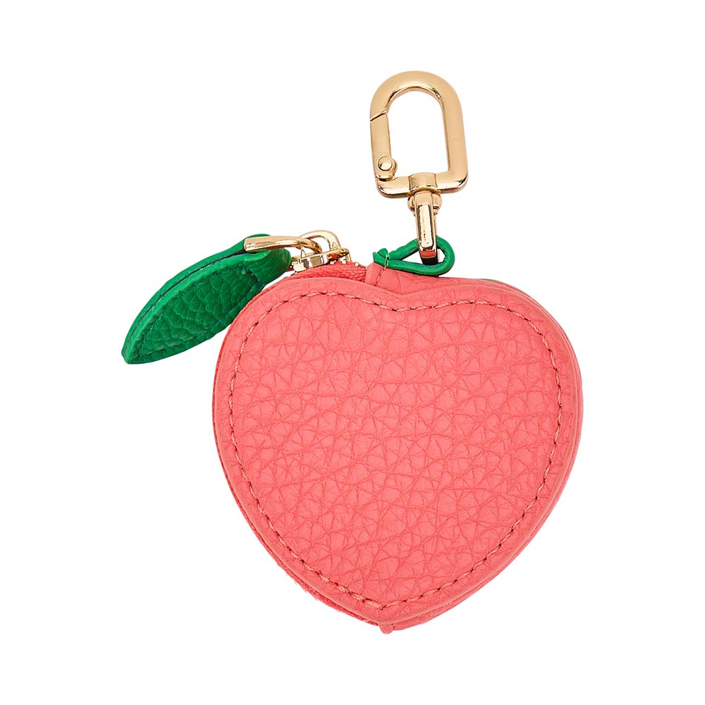 Pink apple-shaped keychain with a gold clip on a white background