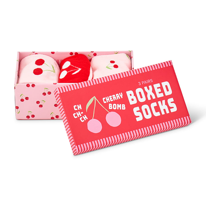 Boxed set of cherry-themed socks with a red label on a white background