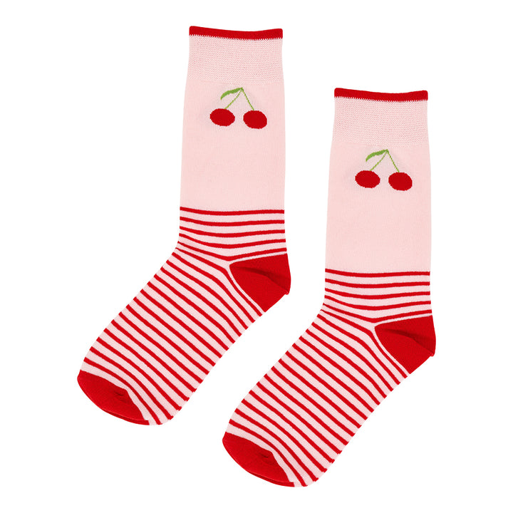 Pair of socks with red and white striped pattern and cherry design on a light pink background