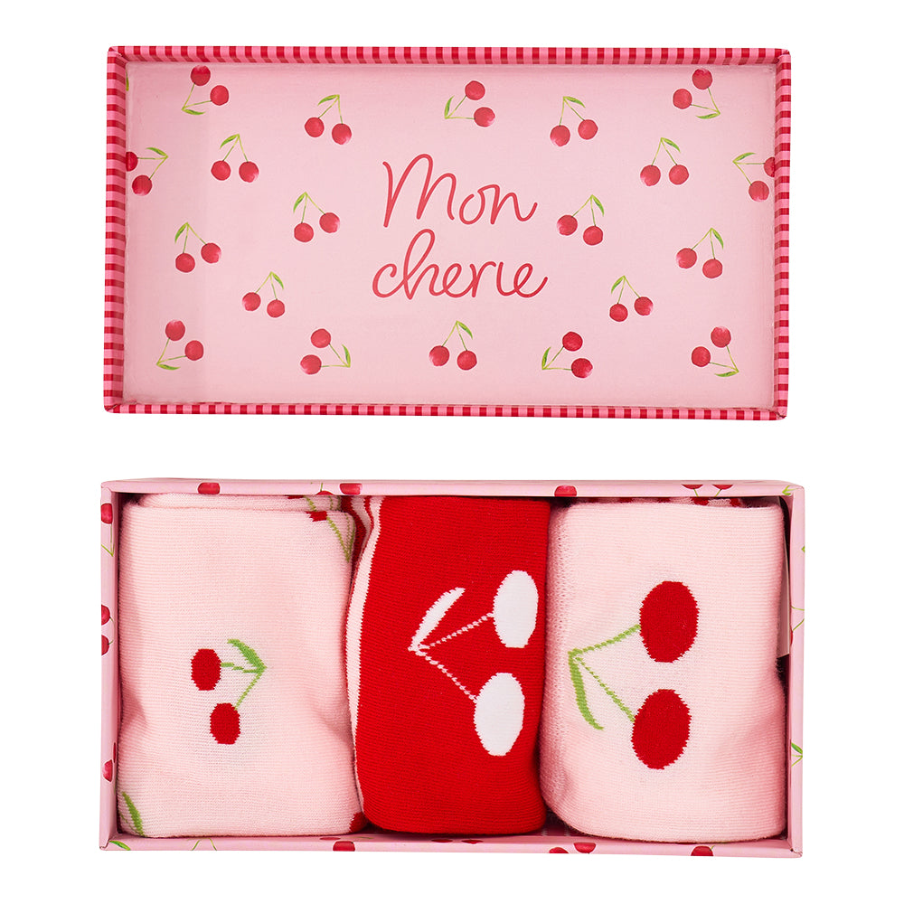 Set of Cherry bomb socks with cherry design in a box labeled 'Mon cherei' on a pink background.