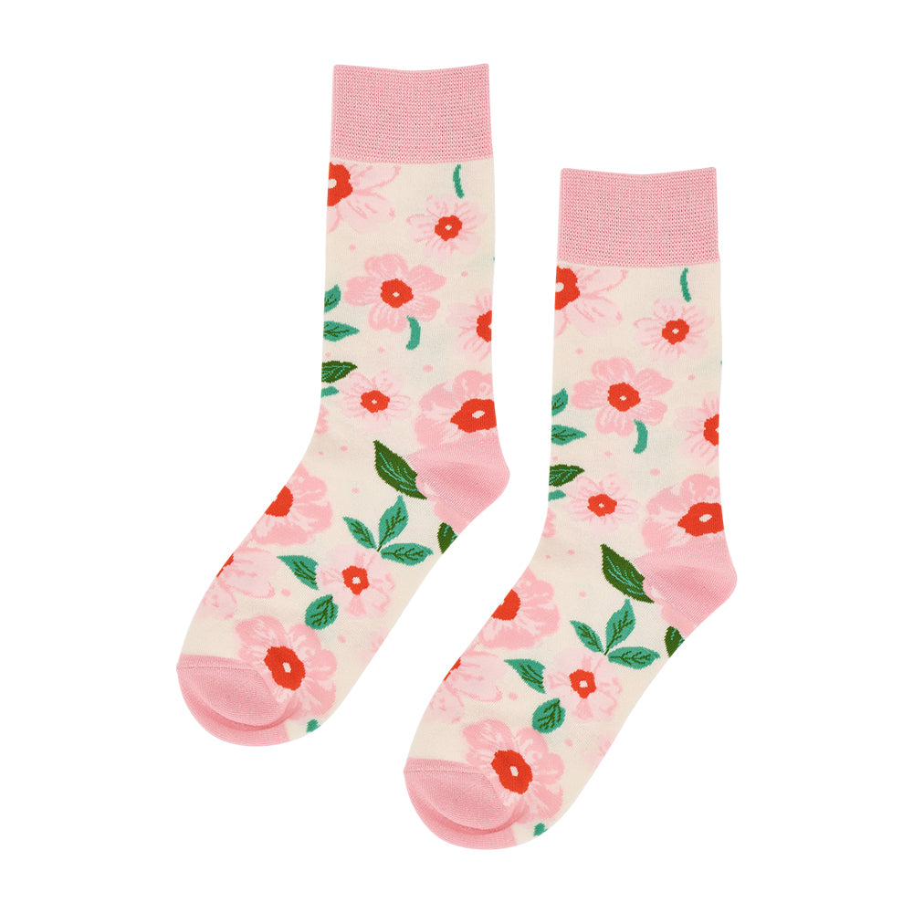 Floral-patterned socks with pink accents on a white background