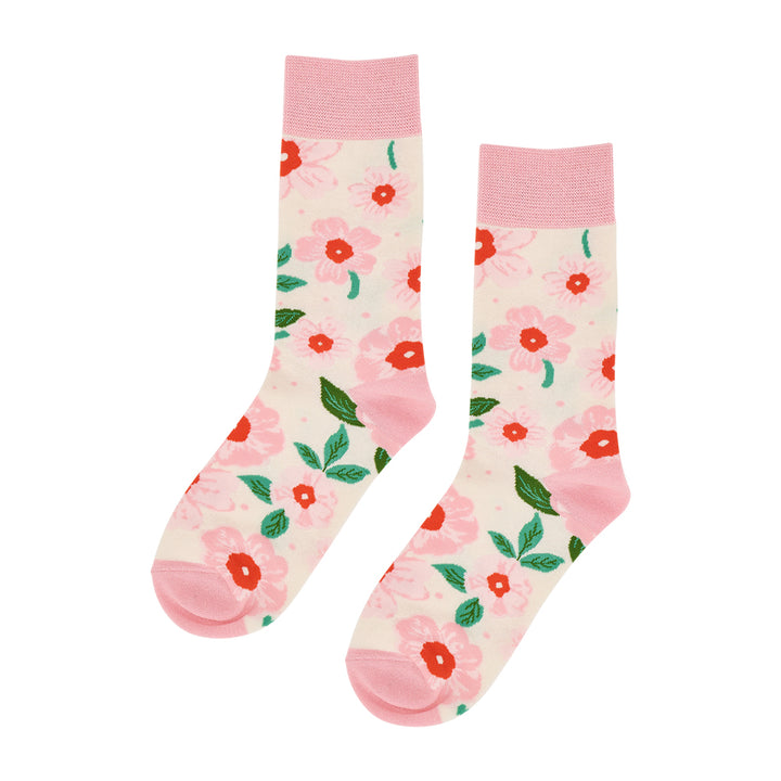 Floral-patterned socks with pink accents on a white background