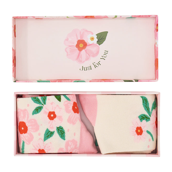 Floral-patterned socks in a gift box with 'Just for You' text.