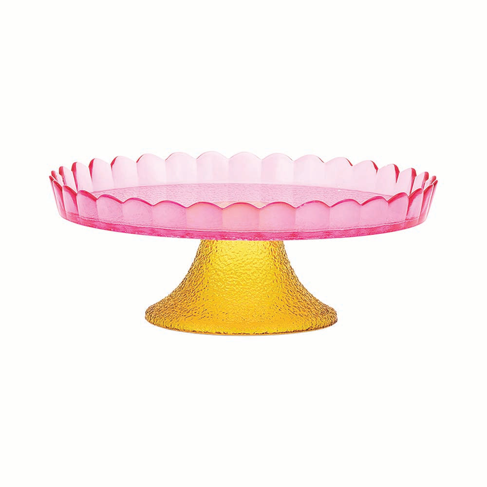 Pink glass cake stand with yellow base on a white background