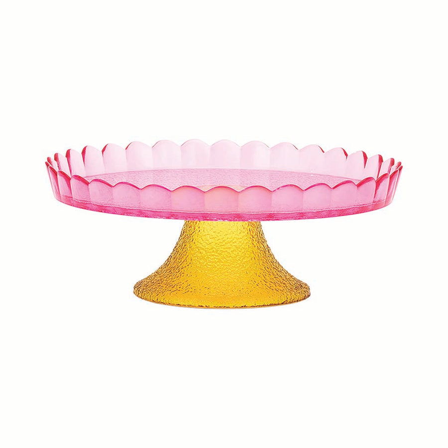 Pink glass cake stand with yellow base on a white background