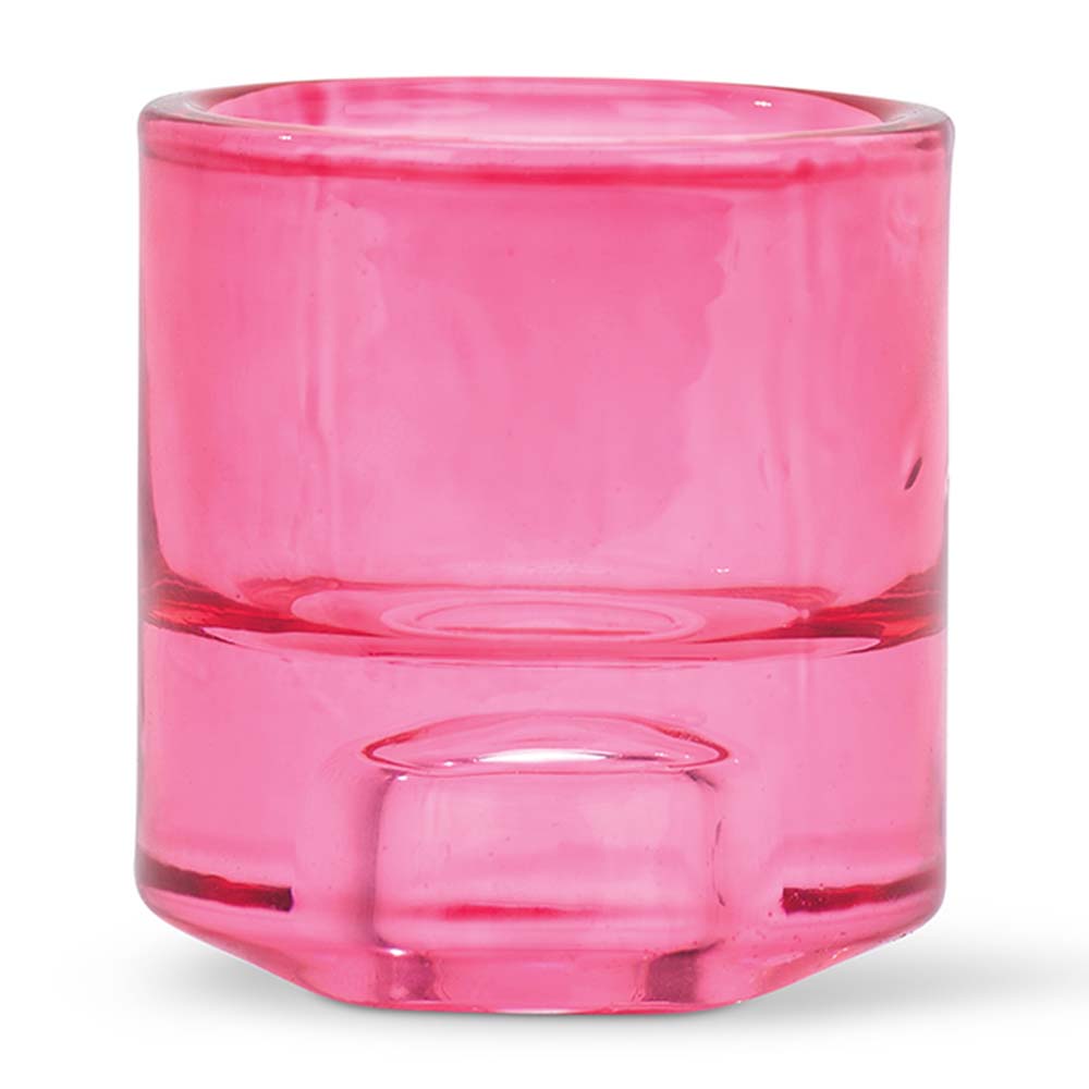 Pink glass candle holder on a white background