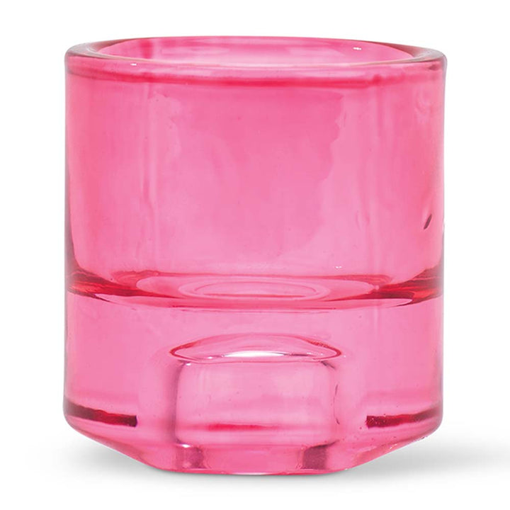 Pink glass candle holder on a white background