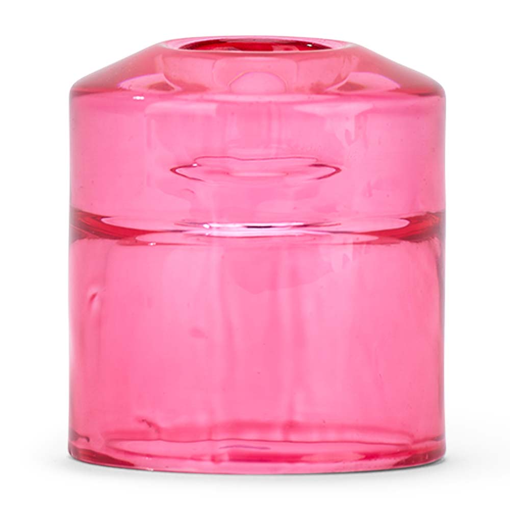Pink glass candle holder on a white background