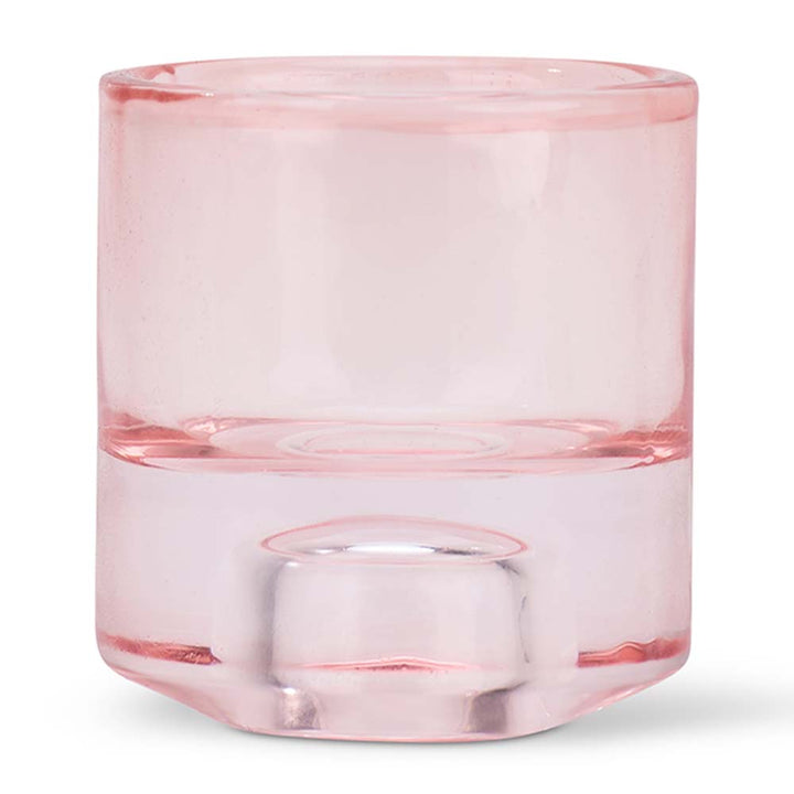 Pink glass candle holder on a white background
