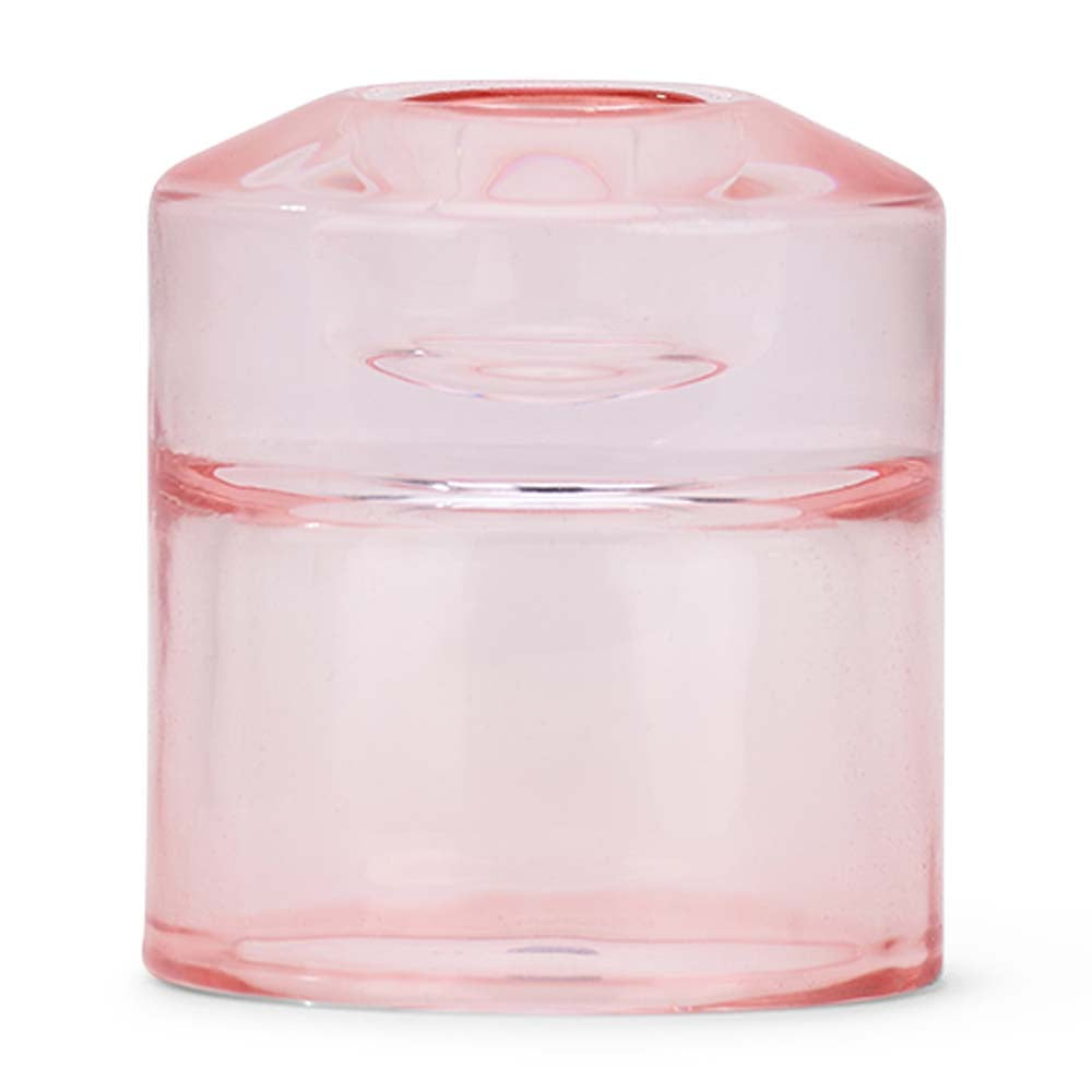 Pink glass candle holder on a white background