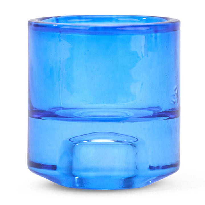 Blue glass candle holder on a white background