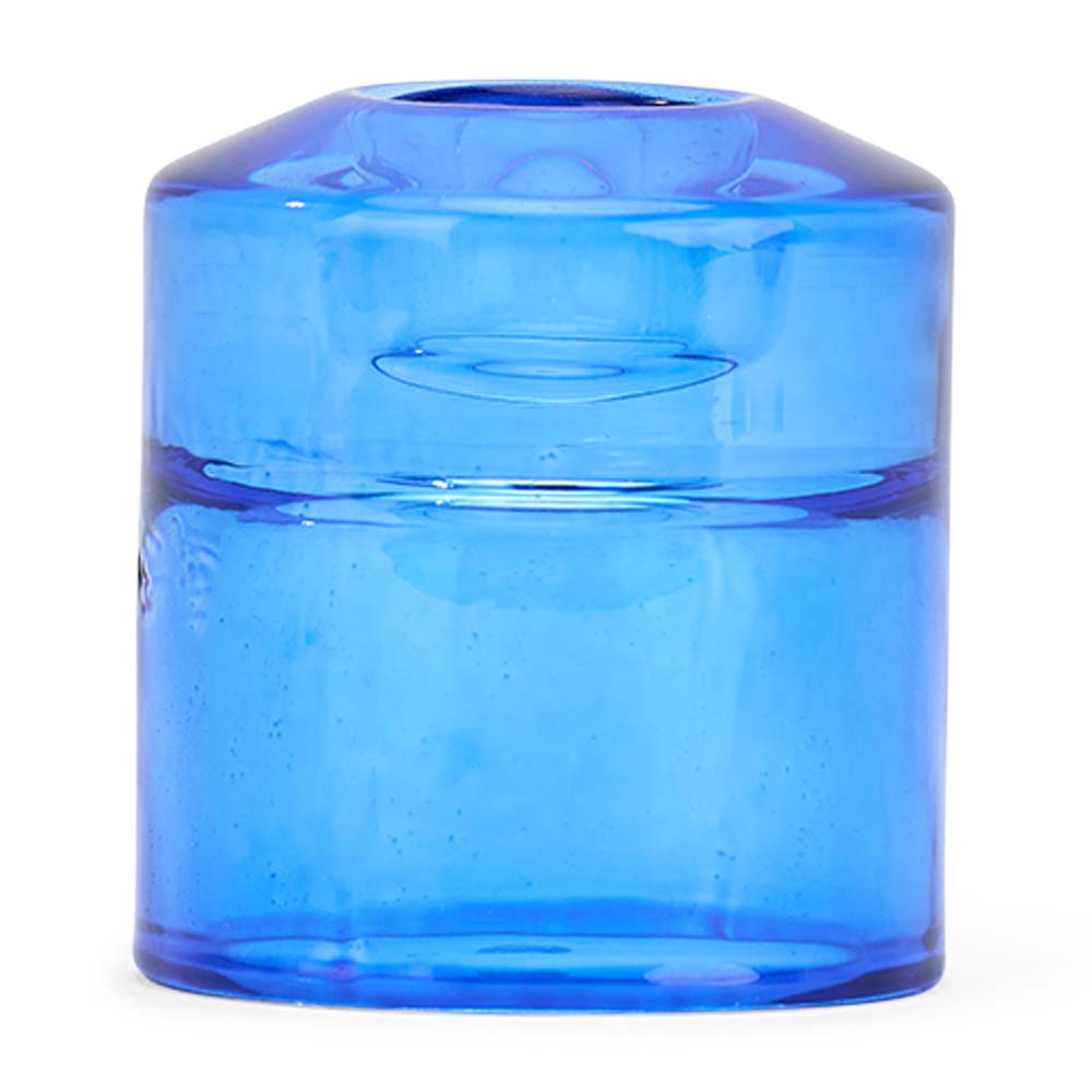 Blue glass candle holder on a white background