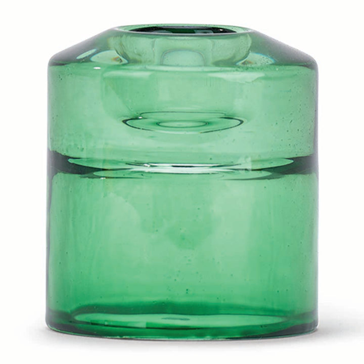 Green glass candle holder on a white background