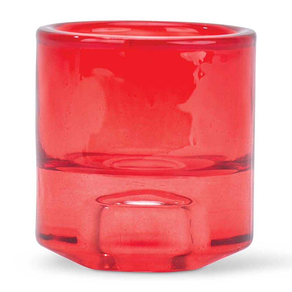Red glass candle holder on a white background