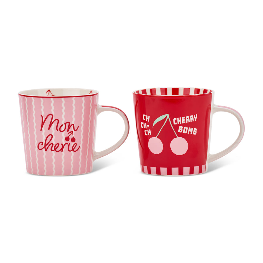 Two mugs with cherry decorative designs and text on a white background