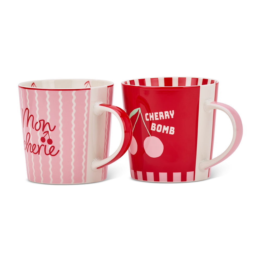 Two mugs with decorative designs and text on a white background