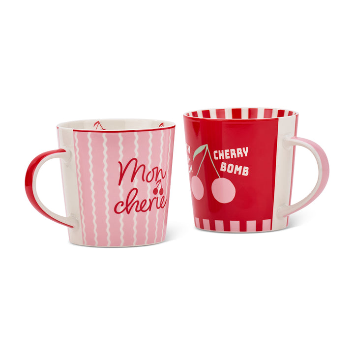 Two mugs with cherry decorative designs and text on a white background