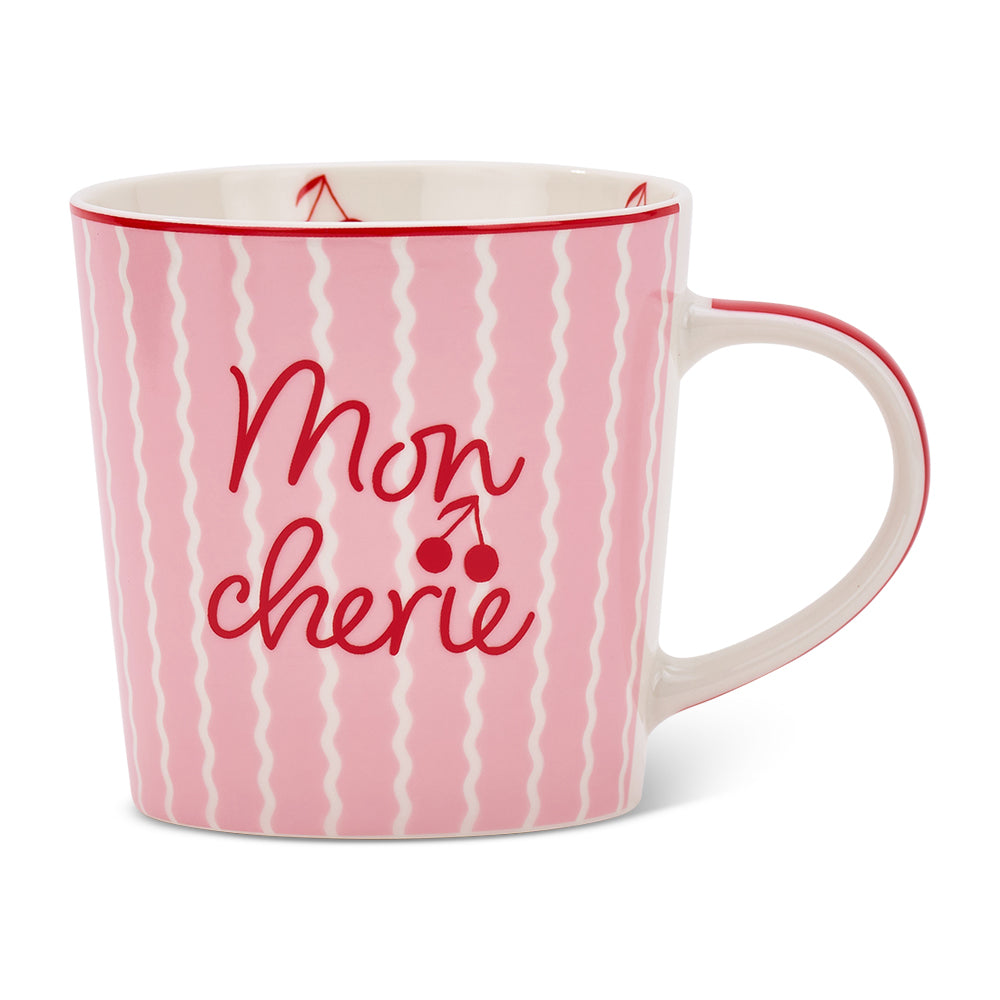 Pink mug with 'Mon Cherie' text and cherry design on a white background
