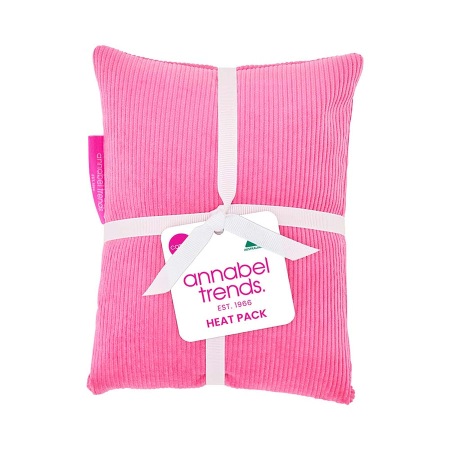 Pink heat pack with a white ribbon and 'annabel trends' tag on a white background