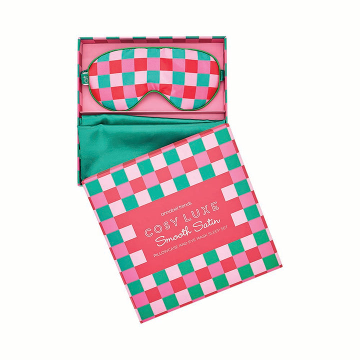 Checkered sleep mask and pouch with 'Cosy Luxe' branding on a white background
