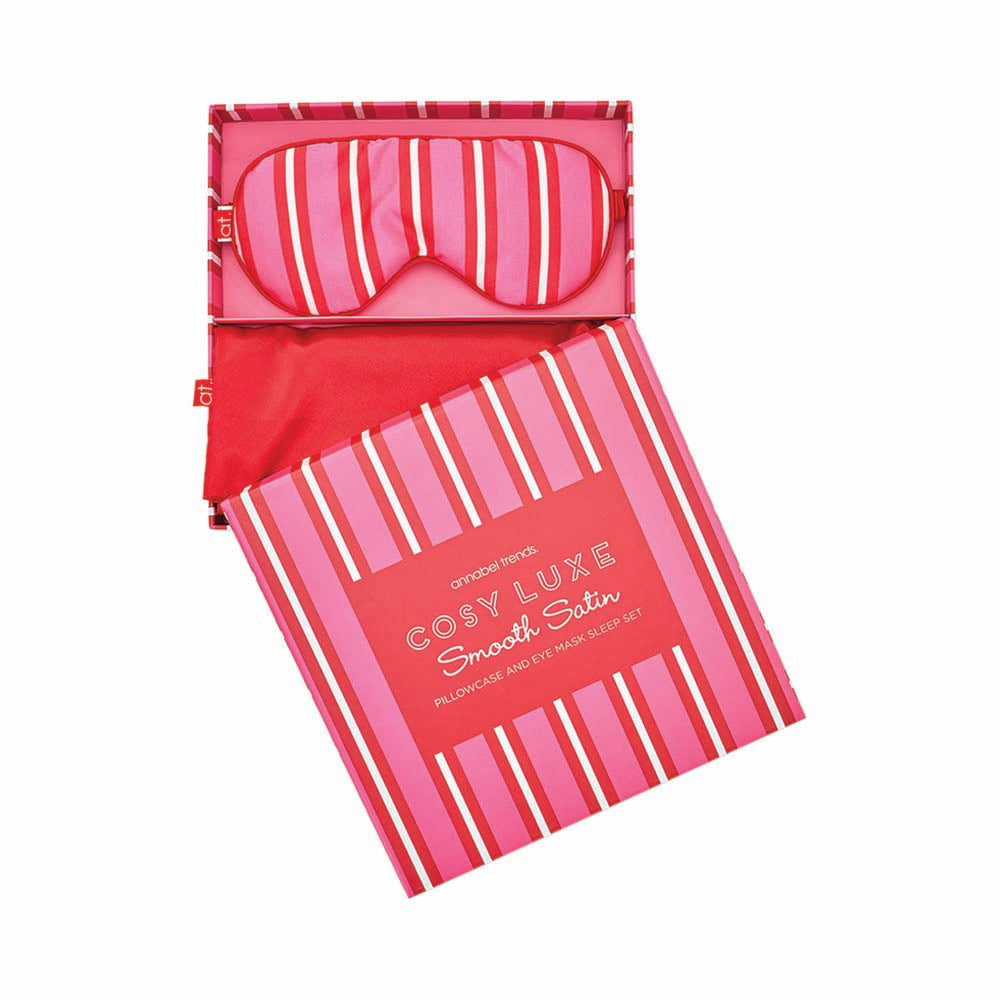 Pink and red striped satin pillowcase with matching sleep mask on a white background