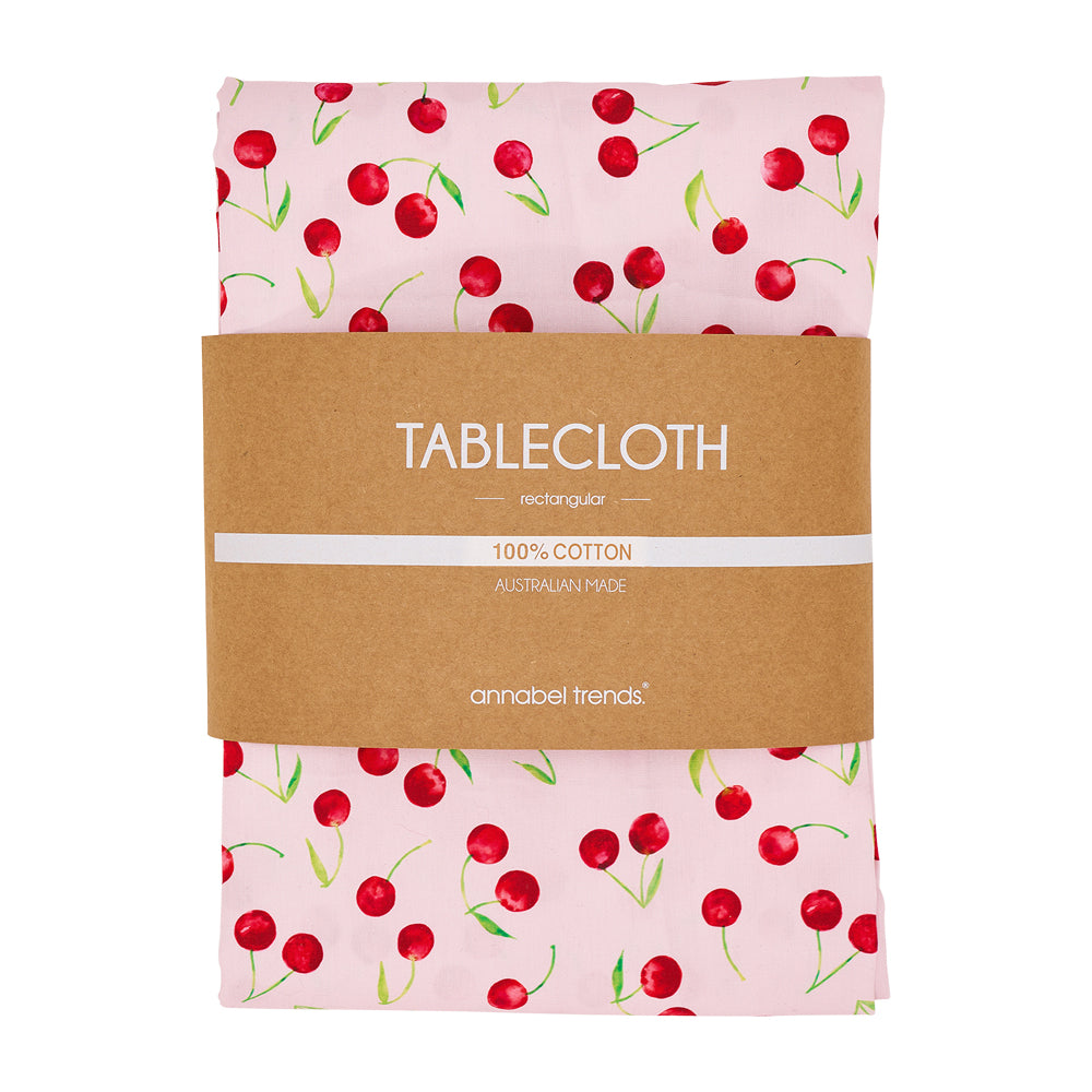Cotton tablecloth with red cherries and pink background