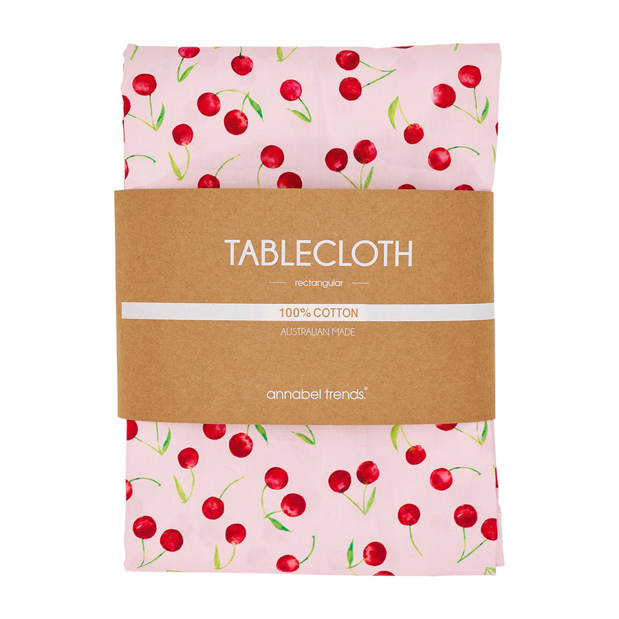 Cotton tablecloth with red cherries and pink background