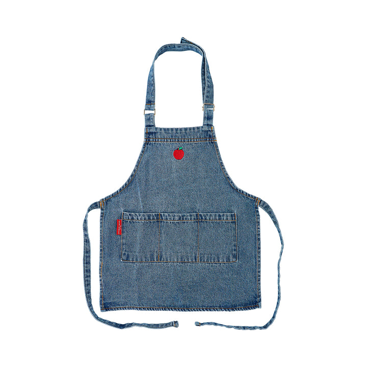 Blue denim kids apron with a red apple patch on a white background