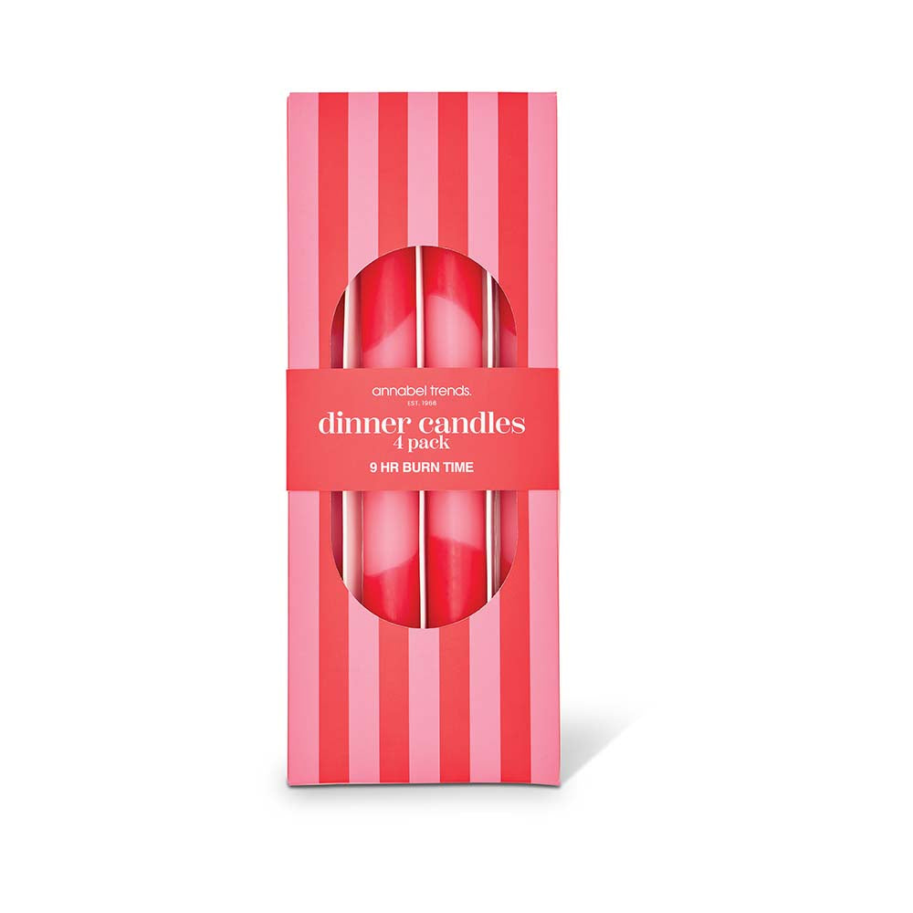 Pack of four red dinner candles in a striped box on a white background